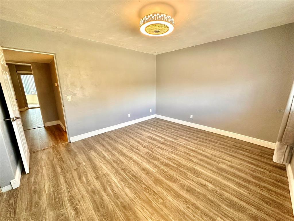 2431 Canadian Way, Unit 37 Clearwater, FL 33763 - Photo 23 of 46 a view of a room with wooden floor
