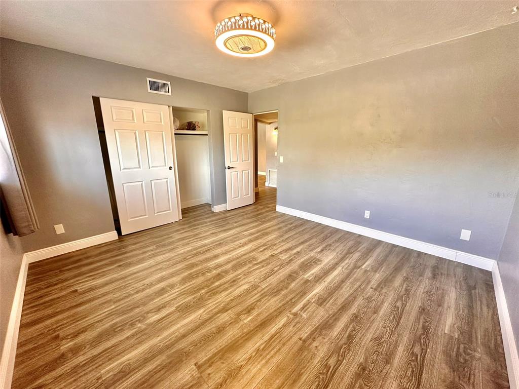 2431 Canadian Way, Unit 37 Clearwater, FL 33763 - Photo 24 of 46 a view of a room with wooden floor and window
