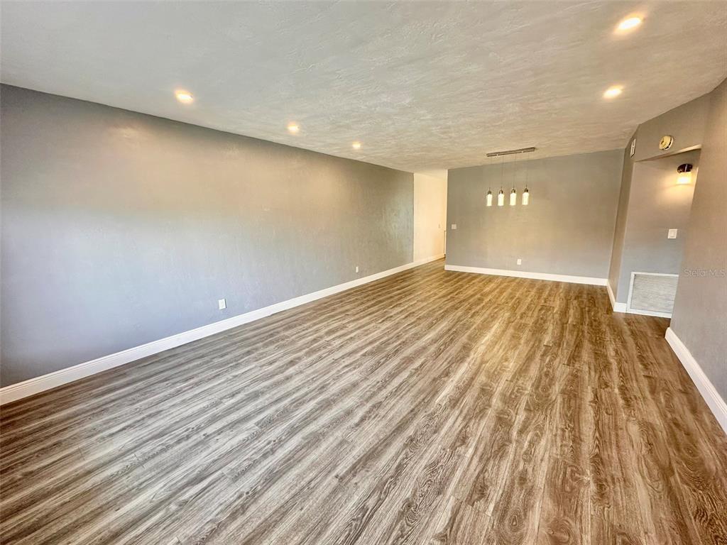 2431 Canadian Way, Unit 37 Clearwater, FL 33763 - Photo 5 of 46 a view of room with wooden floor
