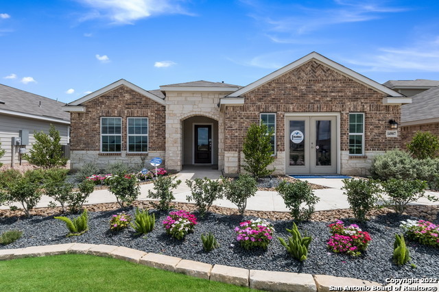15048 Nettleton Mill San Antonio, TX 78254 - Photo 1 of 1 a front view of a house with a yard