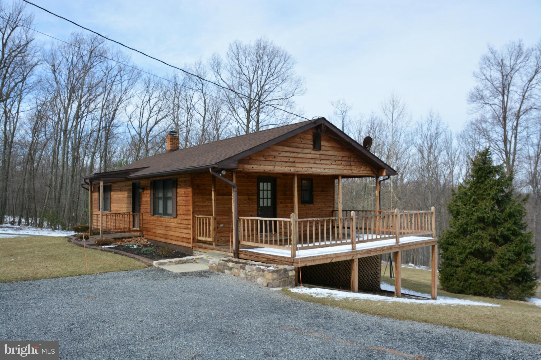 523 Sawlog Road Gore, VA 22637 - Photo 1 of 30 a front view of a house with garage