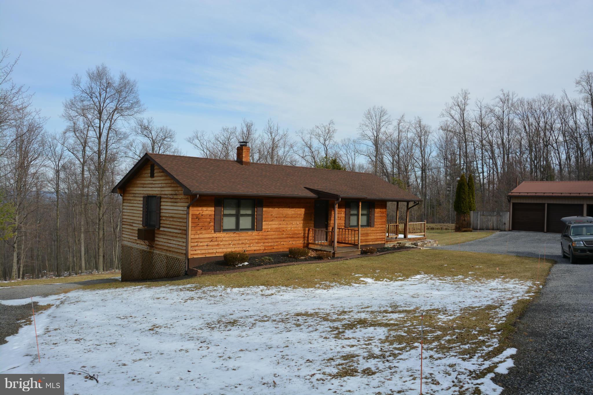 523 Sawlog Road Gore, VA 22637 - Photo 2 of 30 a view of a house with a yard and sitting area