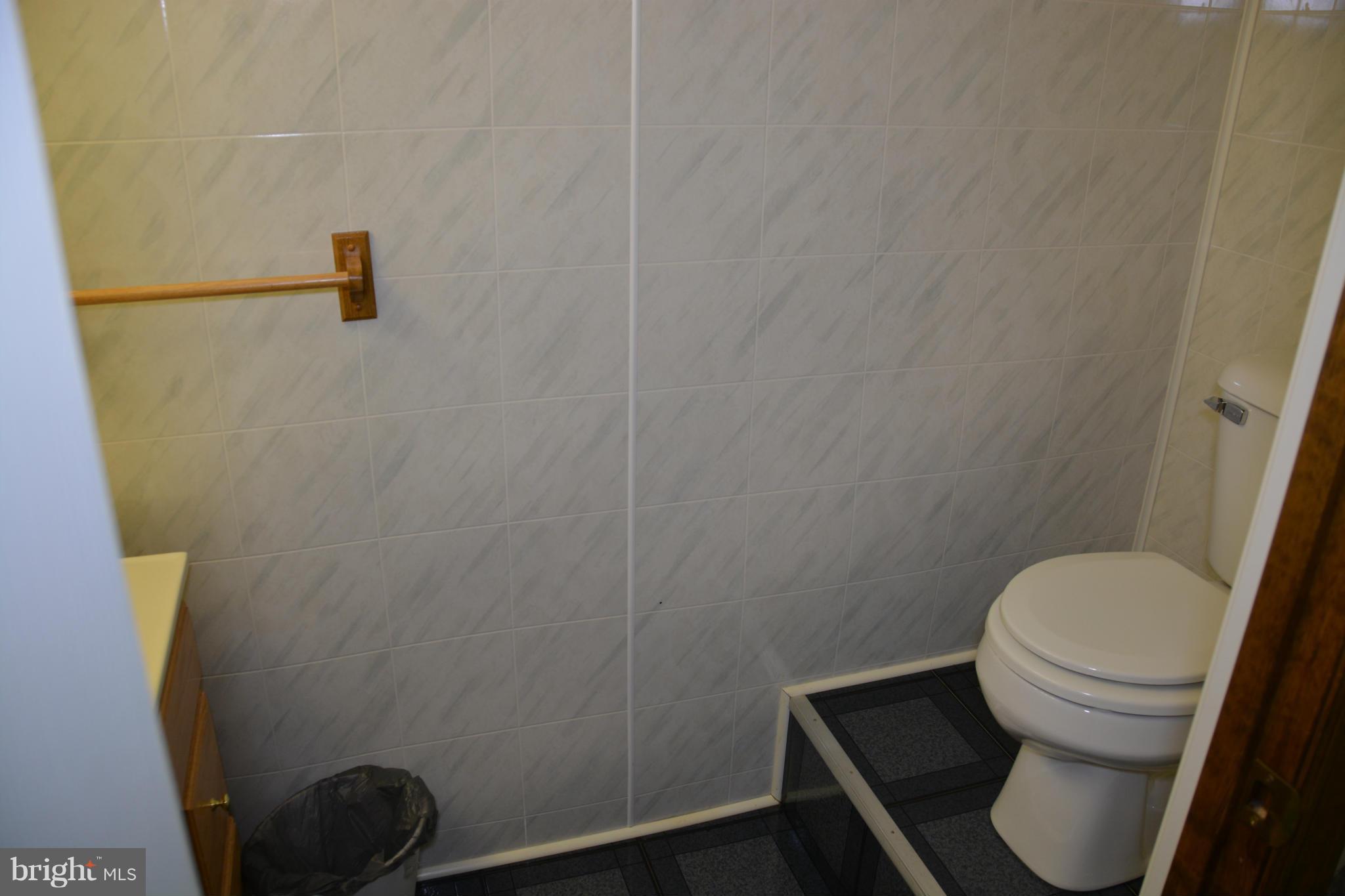 523 Sawlog Road Gore, VA 22637 - Photo 13 of 30 a white toilet sitting next to a shower