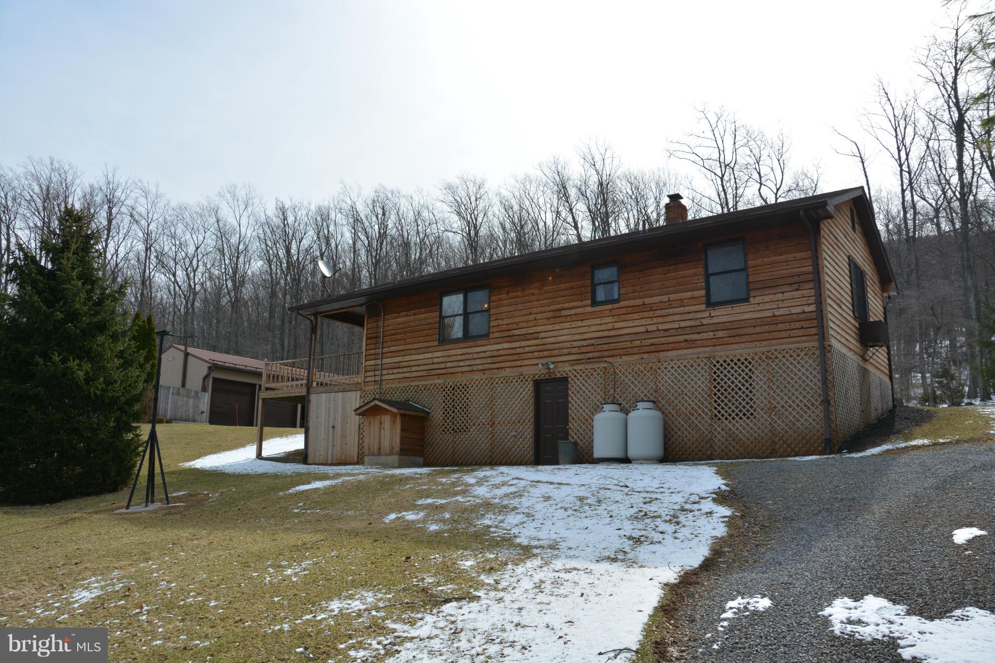 523 Sawlog Road Gore, VA 22637 - Photo 26 of 30 a front view of a house with a yard and garage