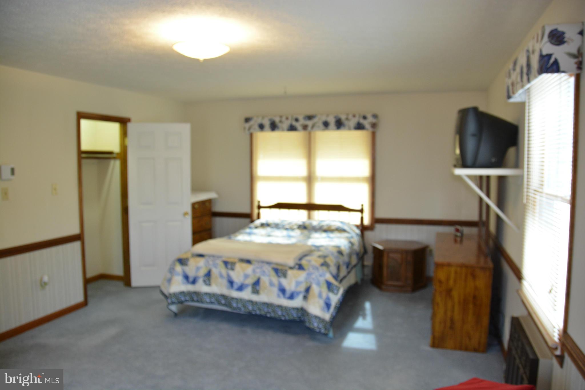 523 Sawlog Road Gore, VA 22637 - Photo 9 of 30 a bedroom with a bed and a window