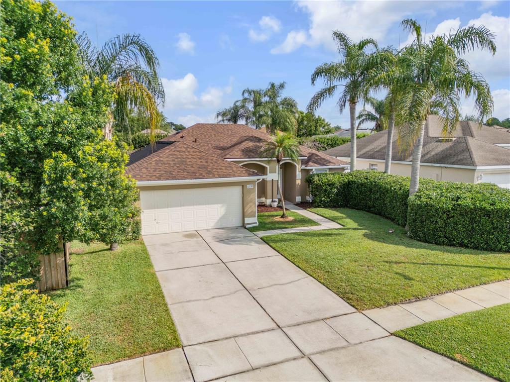 12232 Bronson Way Orlando, FL 32824 - Photo 32 of 32 a front view of a house with a yard