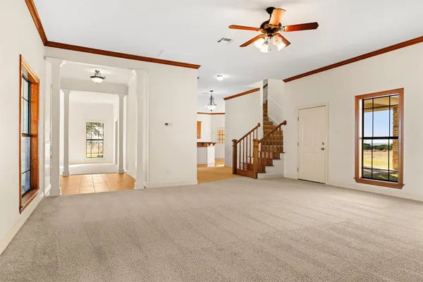 a view of a big room with closet and windows