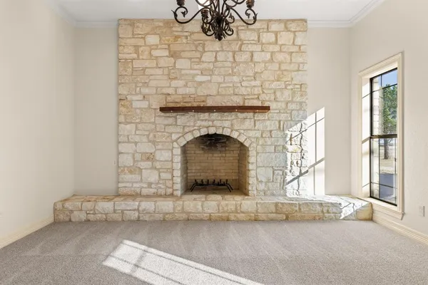 a living room with fireplace and a fireplace