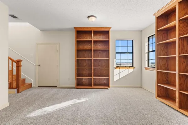 a view of an empty room with a empty shelves