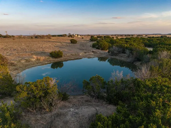 a view of a lake with a city