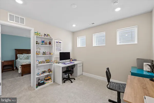 a bed room with a bed and a chair