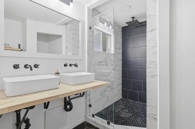 a bathroom with a sink a vanity and a mirror