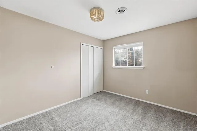 a view of a room that has a window in it