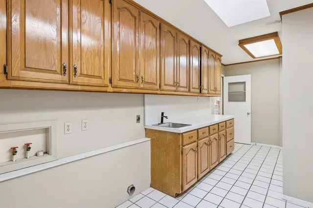 a kitchen with stainless steel appliances granite countertop a sink and cabinets