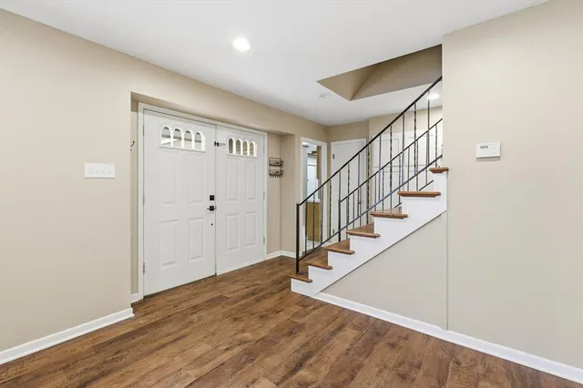 a view of entryway with wooden floor