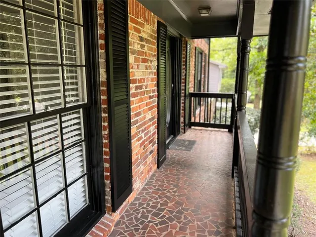 a view of hallway with wooden floor