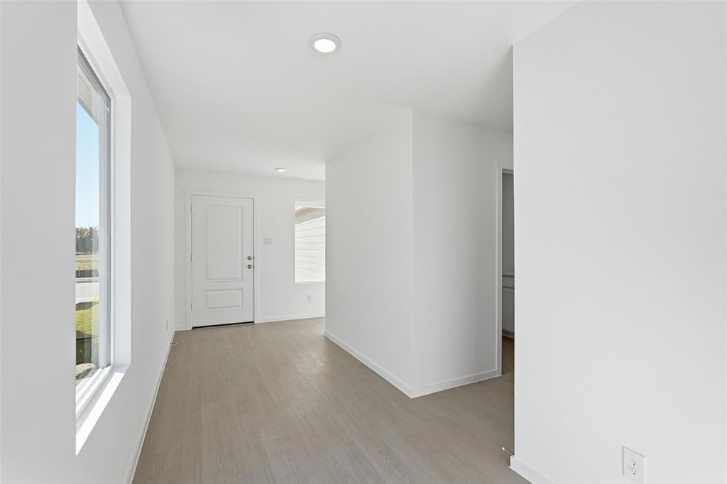 3919 Selawik Street Sherman, TX 75090 - Photo 14 of 21 a view of a hallway to rooms