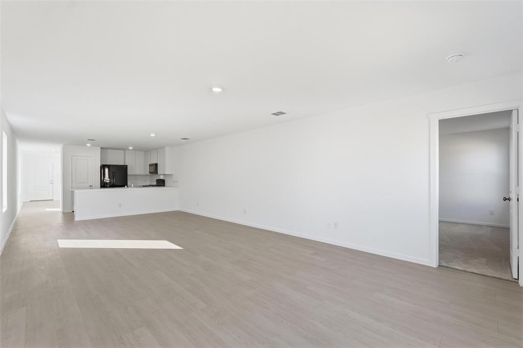 3919 Selawik Street Sherman, TX 75090 - Photo 3 of 21 a view of empty room with wooden floor