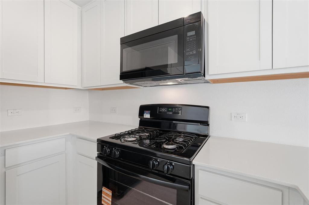 3919 Selawik Street Sherman, TX 75090 - Photo 6 of 21 a stove top oven sitting inside of a kitchen