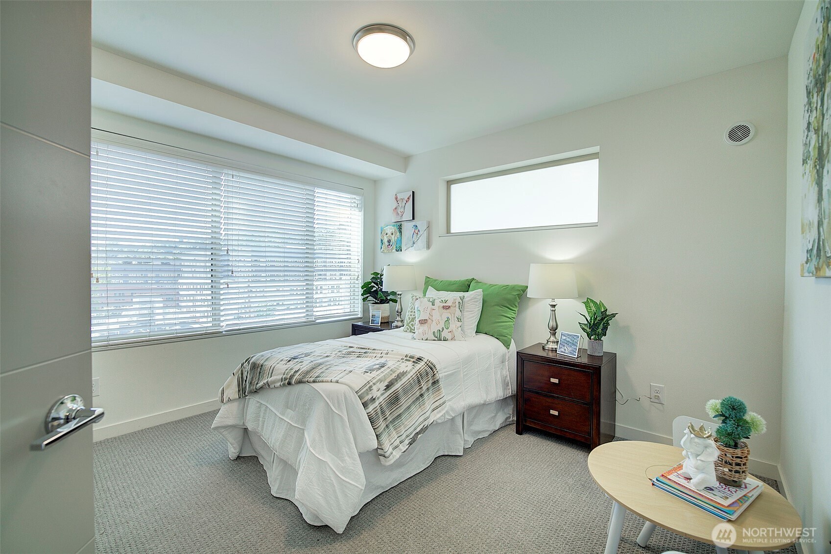 1617 South Weller Street Seattle, WA 98144 - Photo 14 of 19 a bedroom with a bed and a chair