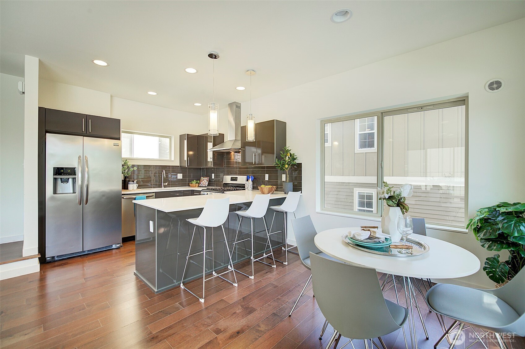 1617 South Weller Street Seattle, WA 98144 - Photo 6 of 19 a kitchen with a table and chairs in it