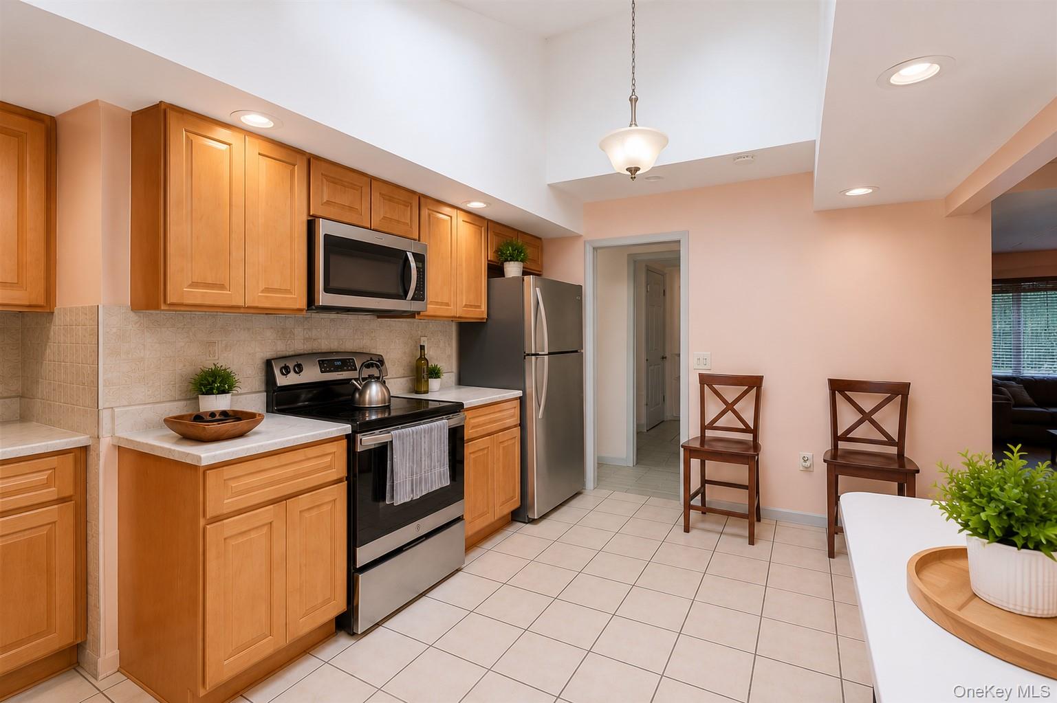 1 Windsor Road Monroe, NY 10950 - Photo 7 of 20 a kitchen with stainless steel appliances granite countertop a stove a sink and a microwave