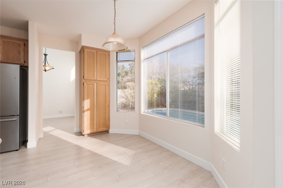 1828 Jack Rabbit Way Las Vegas, NV 89128 - Photo 13 of 39 Kitchen nook area overlooking the pool