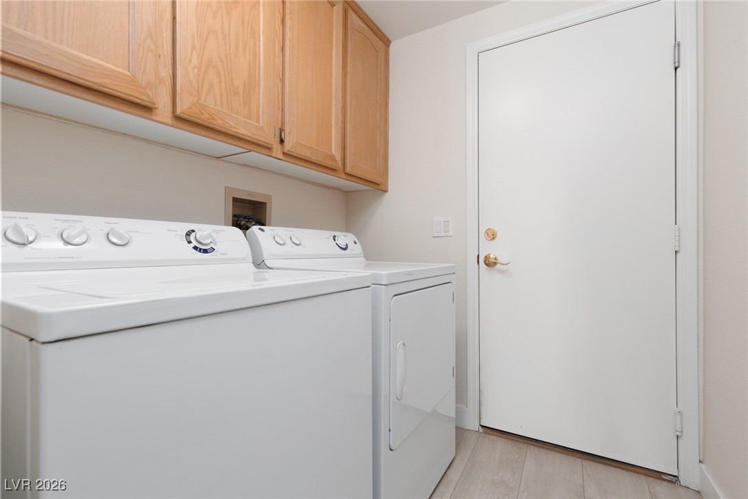 1828 Jack Rabbit Way Las Vegas, NV 89128 - Photo 19 of 39 Laundry room with gas dryer hookup and upper cabinet storage