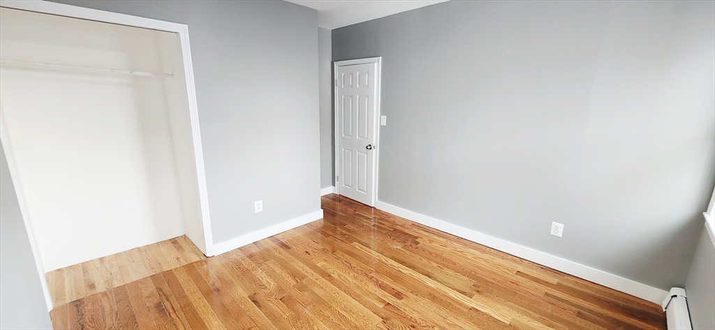 3 Wilbur Court, Unit 2 Boston, MA 02128 - Photo 18 of 25 a view of a room with wooden floor