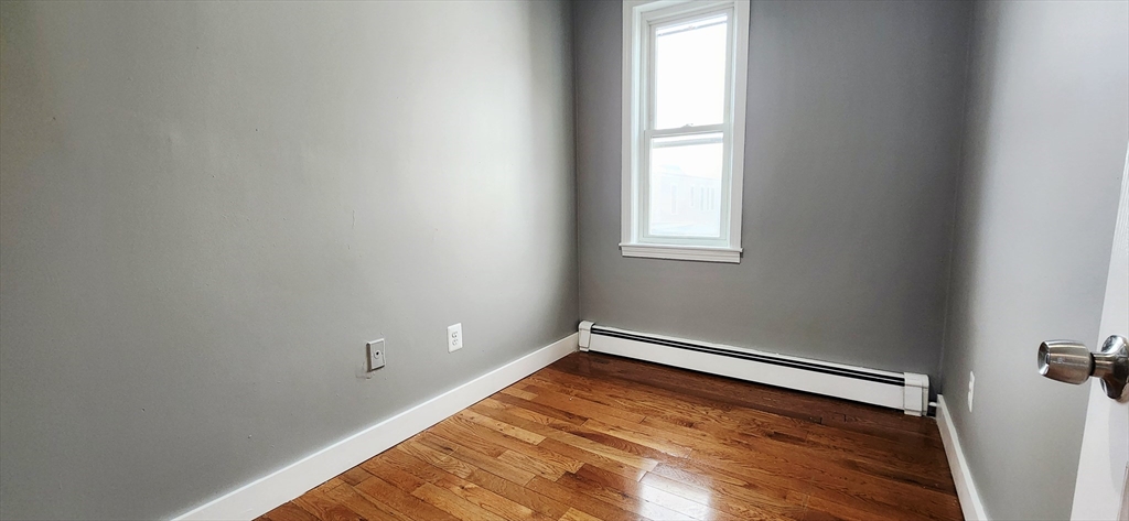 3 Wilbur Court, Unit 2 Boston, MA 02128 - Photo 20 of 25 a view of empty room with window