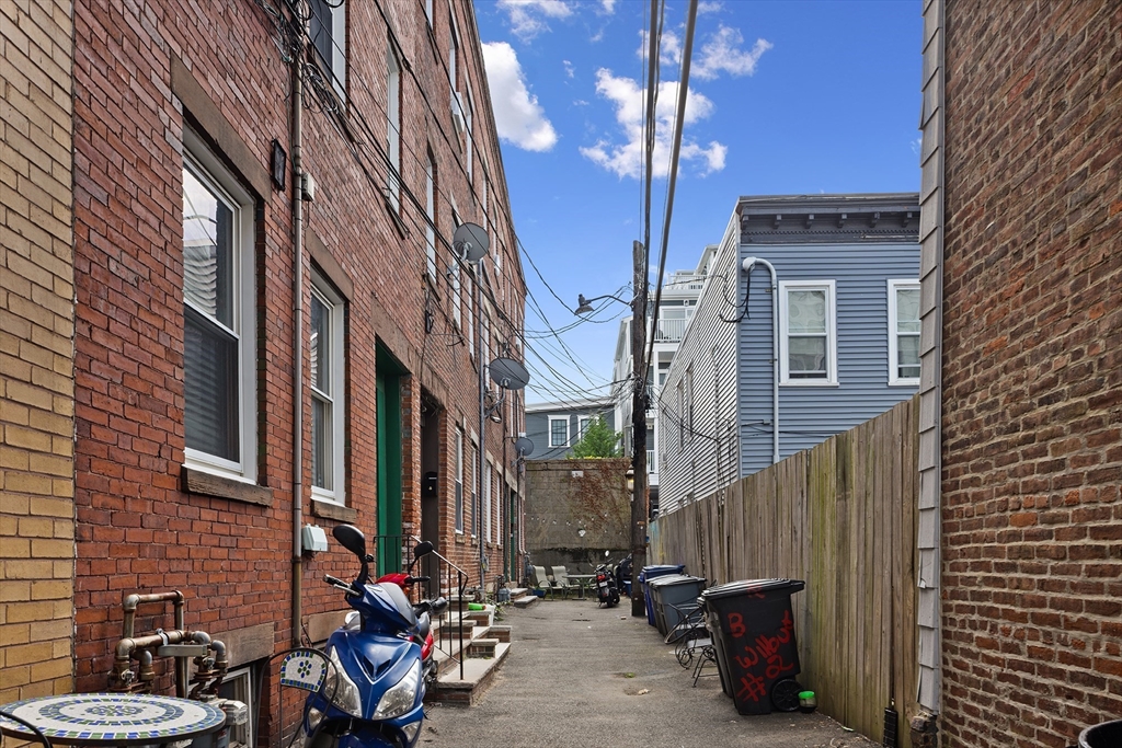 3 Wilbur Court, Unit 2 Boston, MA 02128 - Photo 25 of 25 a view of a brick building with many windows
