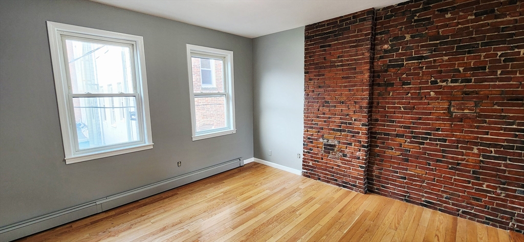 3 Wilbur Court, Unit 2 Boston, MA 02128 - Photo 9 of 25 a view of empty room with windows