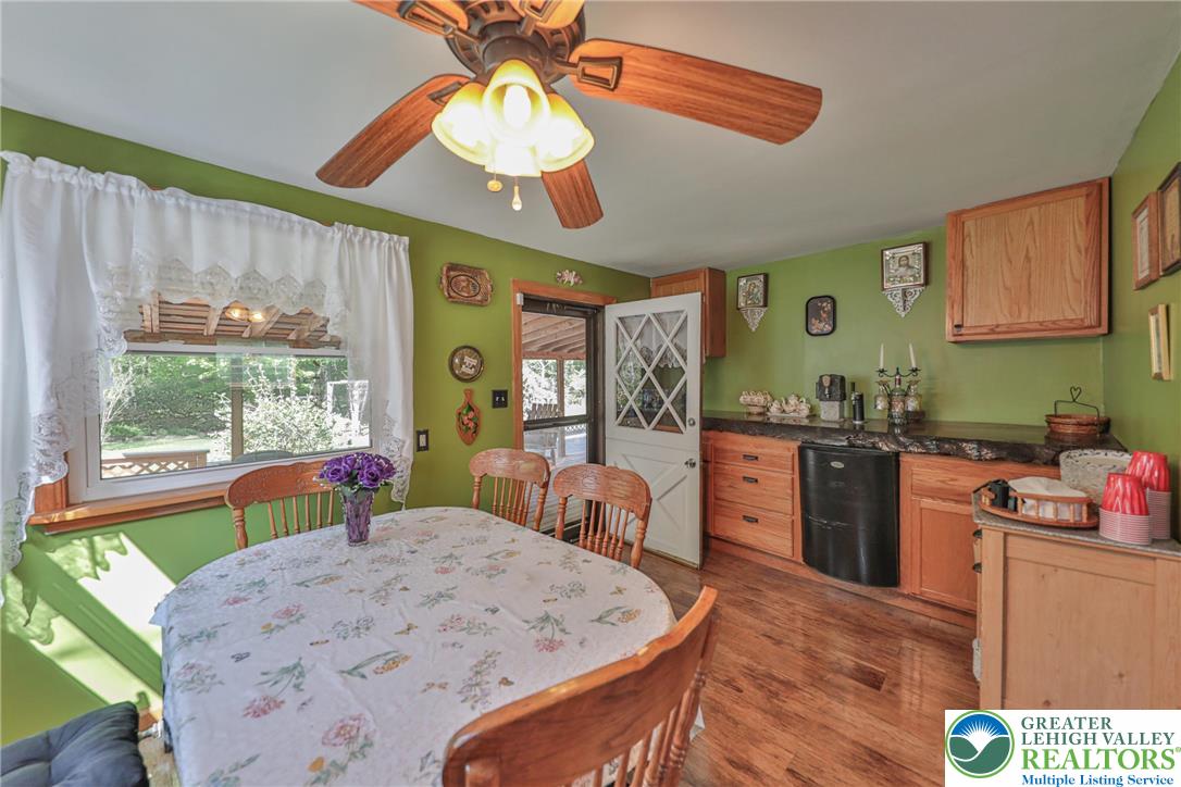 331 Cranberry Creek Road Cresco, PA 18326 - Photo 5 of 95 A country-style eat-in kitchen with warm wood flooring and a bright window overlooking the outdoors.