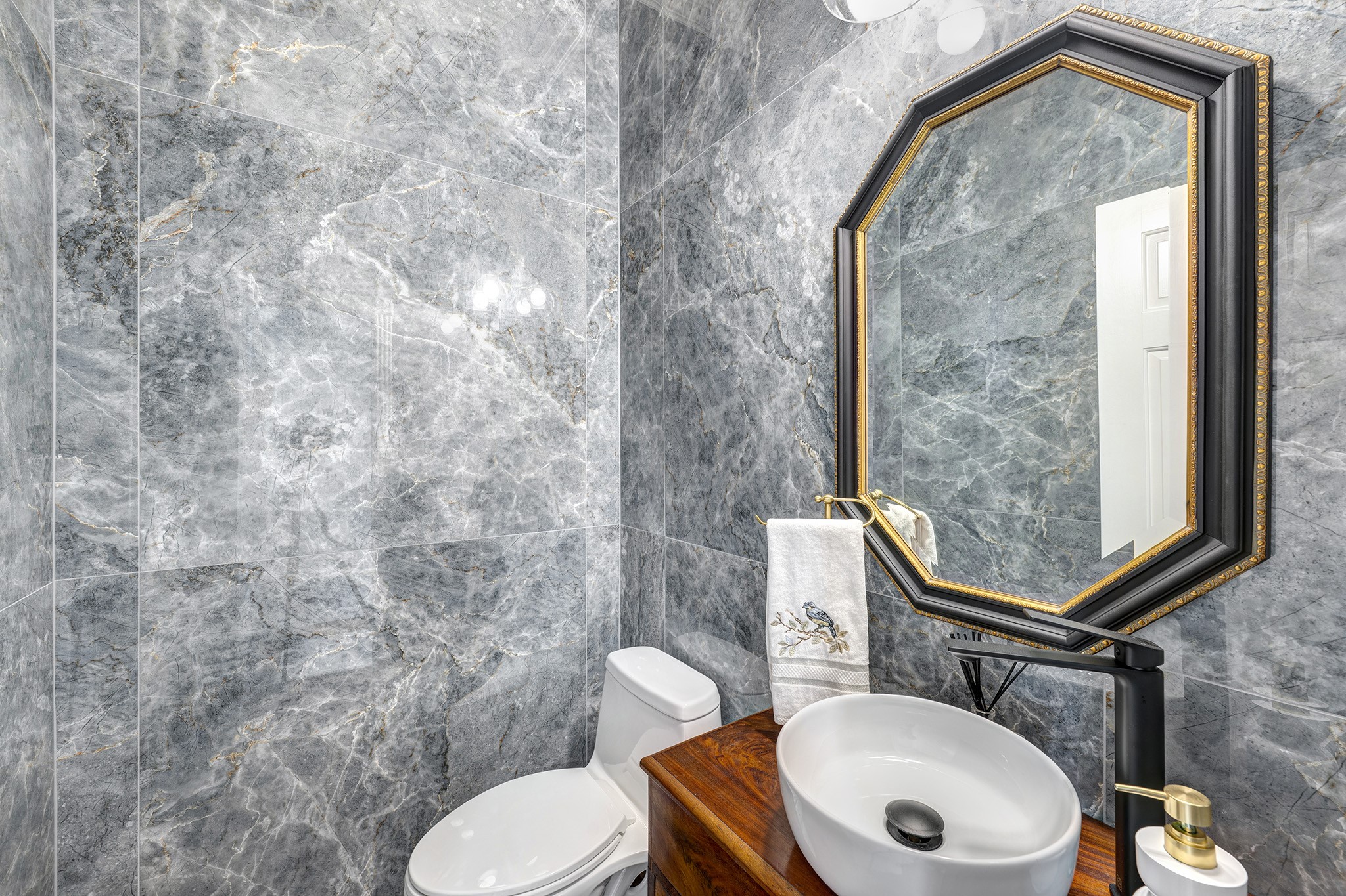 14310 Spring Maple Lane Houston, TX 77062 - Photo 14 of 40 a bathroom with a toilet mirror vanity and a sink