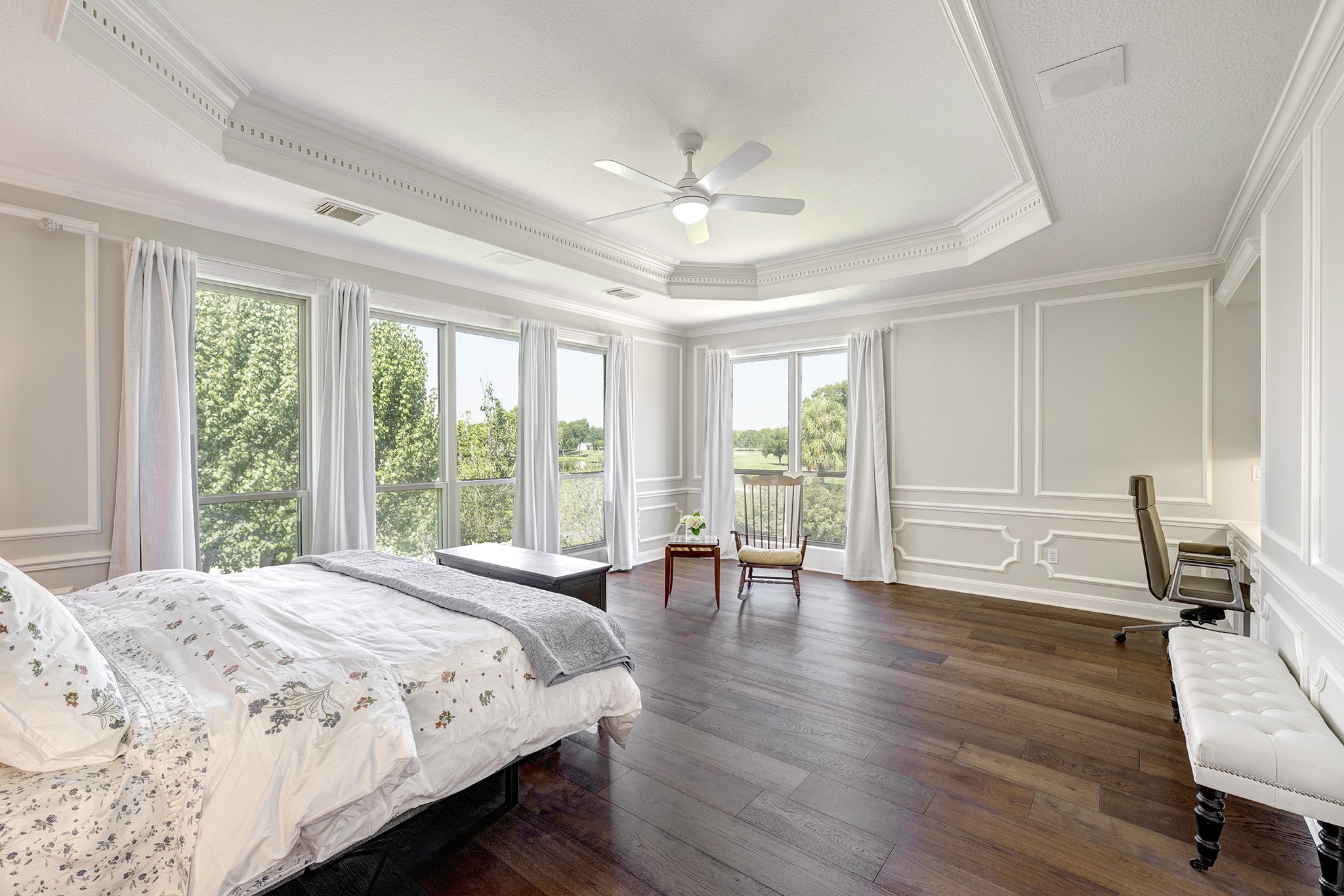 14310 Spring Maple Lane Houston, TX 77062 - Photo 16 of 40 a spacious bedroom with a large bed a large window and wooden floor