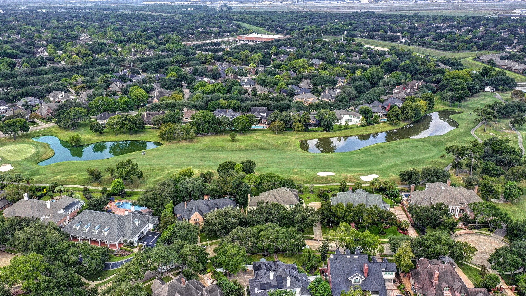 14310 Spring Maple Lane Houston, TX 77062 - Photo 2 of 40 an aerial view of residential houses with outdoor space and trees