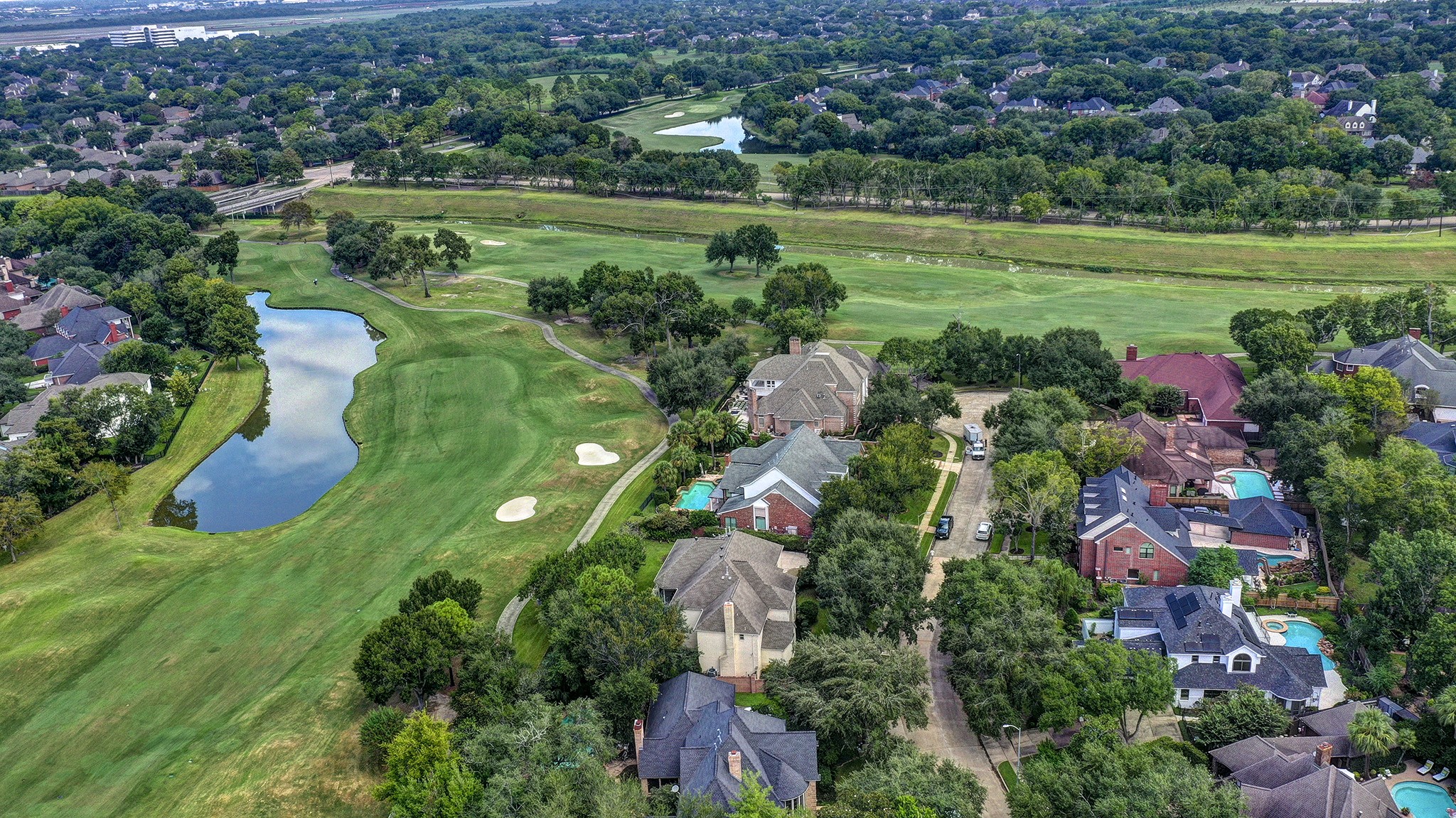 14310 Spring Maple Lane Houston, TX 77062 - Photo 21 of 40 a view of a garden with plants and large trees