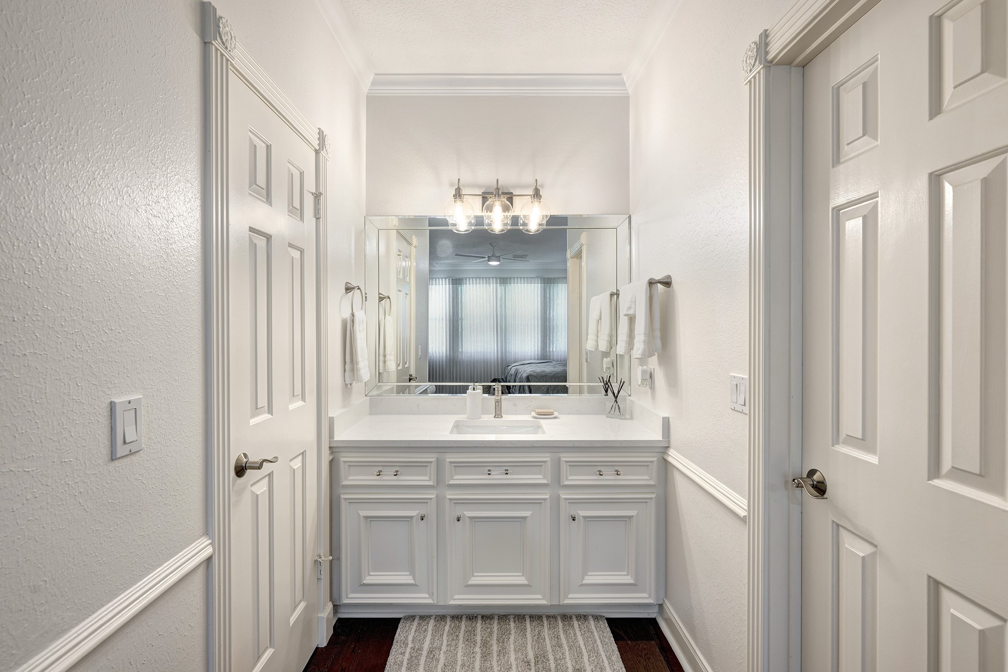 14310 Spring Maple Lane Houston, TX 77062 - Photo 26 of 40 a bathroom with a sink vanity granite and a mirror