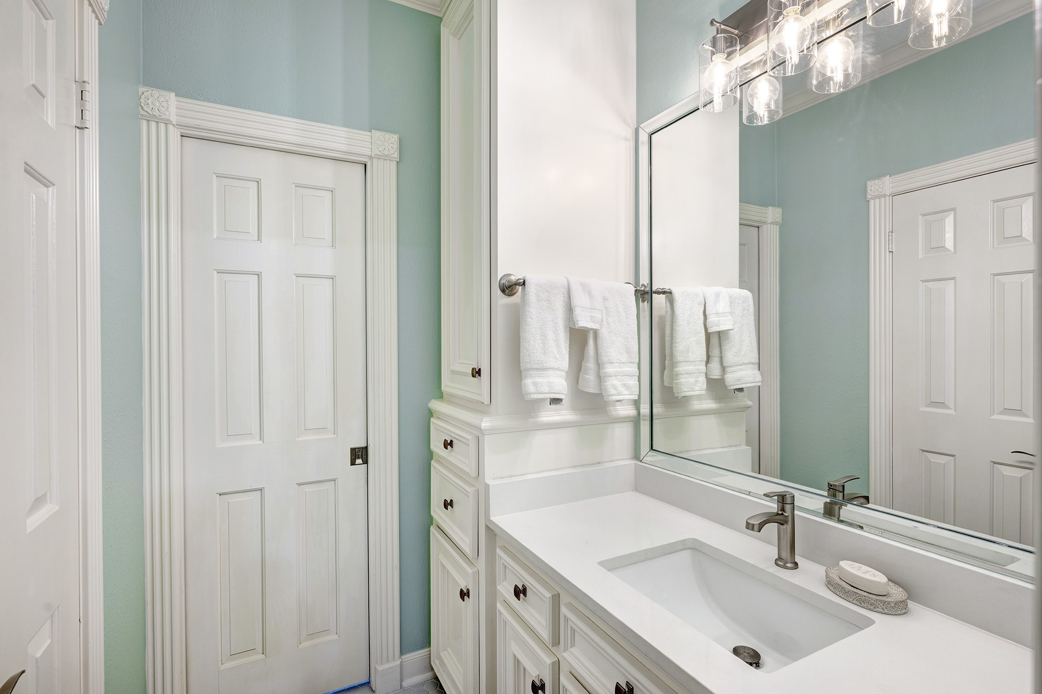 14310 Spring Maple Lane Houston, TX 77062 - Photo 28 of 40 a bathroom with a sink a mirror and a shower