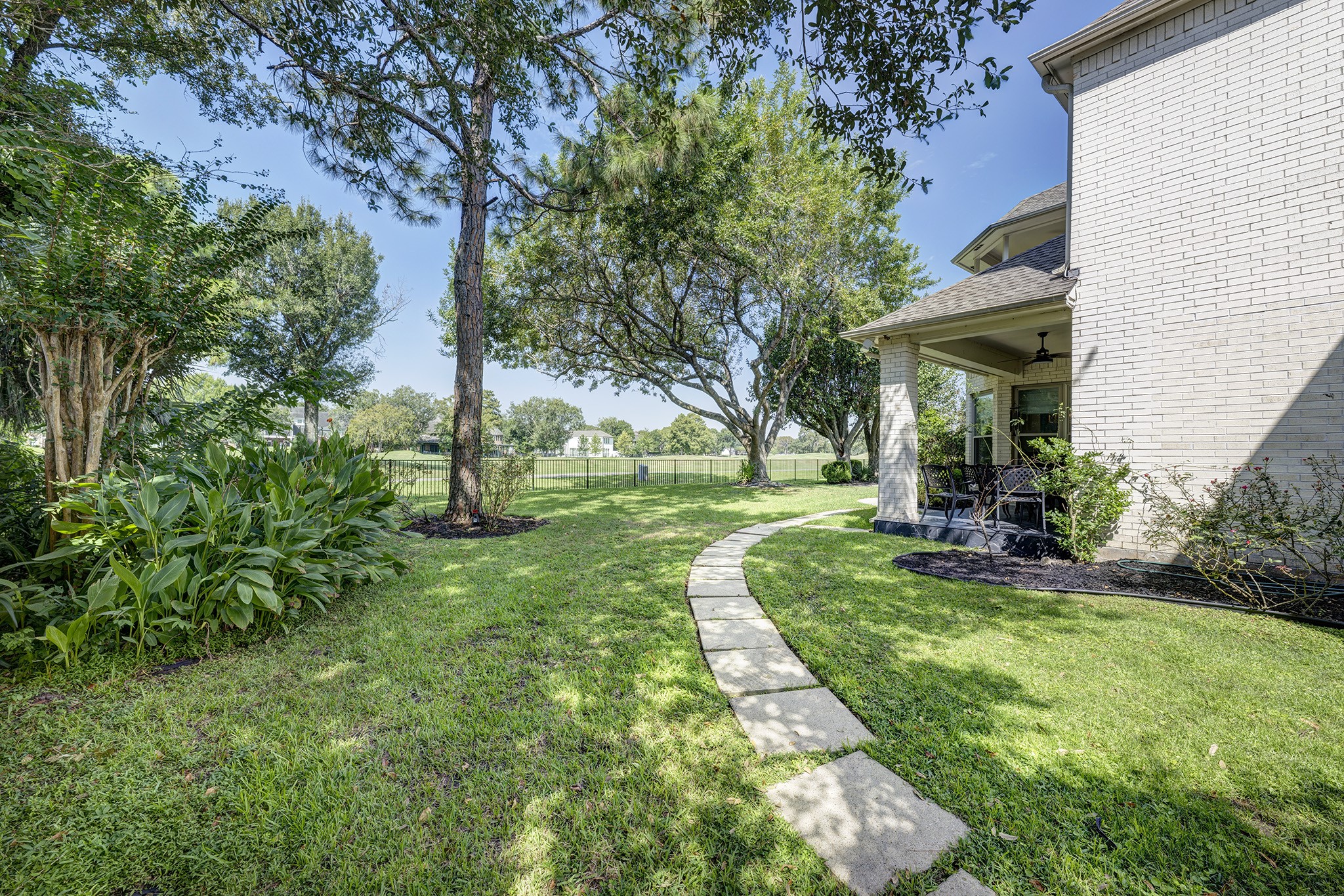 14310 Spring Maple Lane Houston, TX 77062 - Photo 33 of 40 a view of a house with a backyard