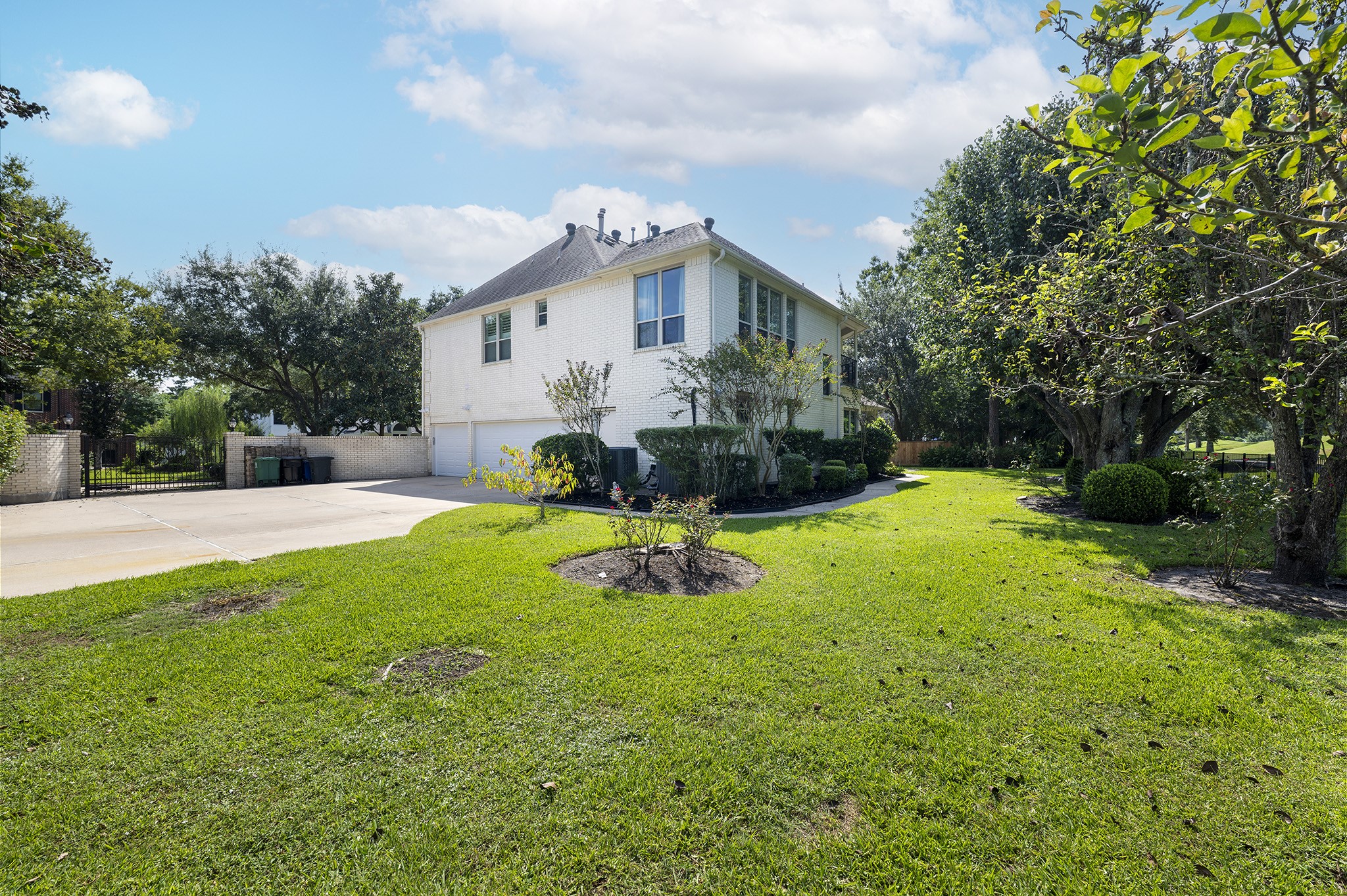14310 Spring Maple Lane Houston, TX 77062 - Photo 35 of 40 a view of a house with backyard and sitting area
