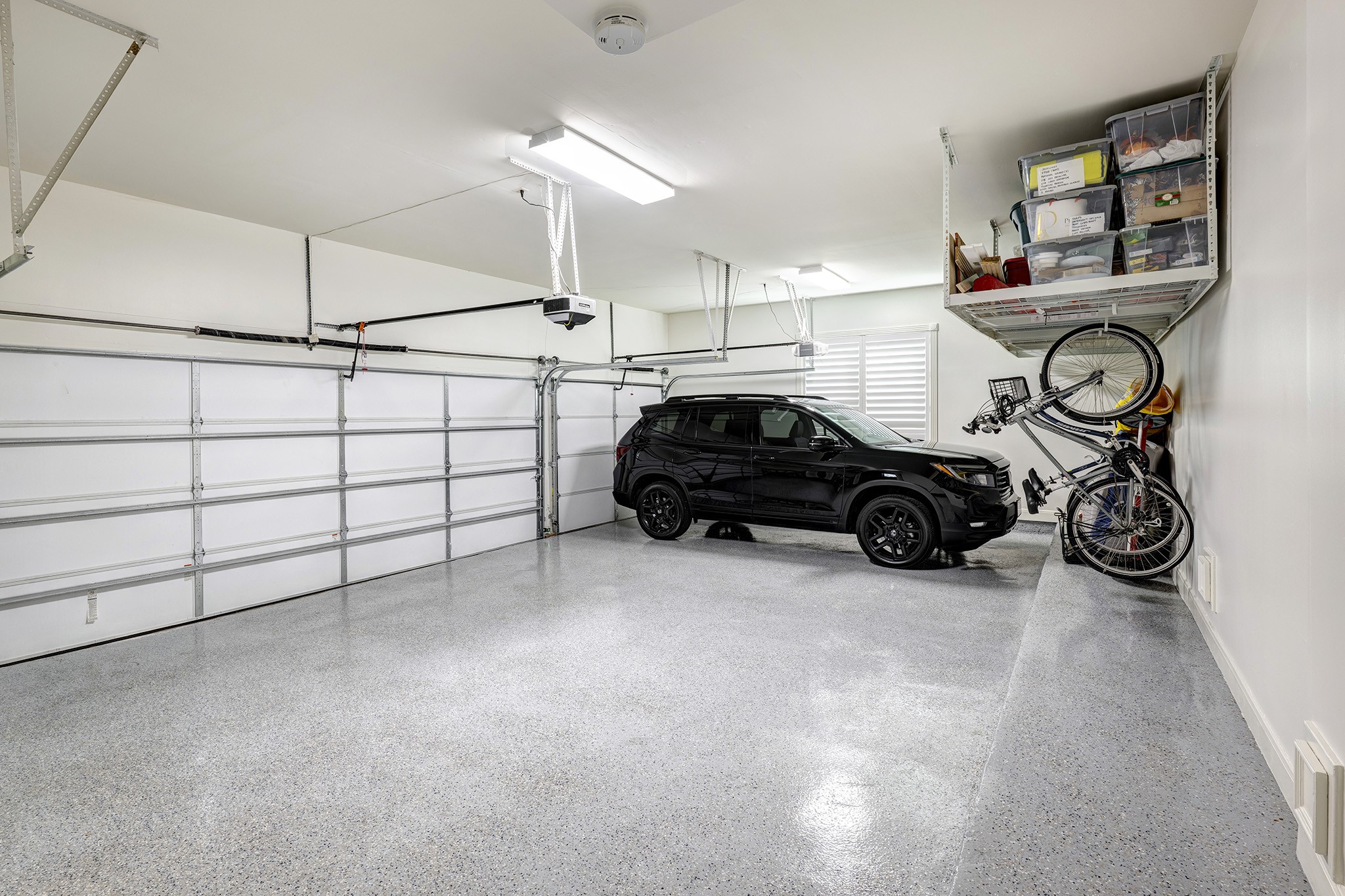 14310 Spring Maple Lane Houston, TX 77062 - Photo 36 of 40 a car parked in a garage