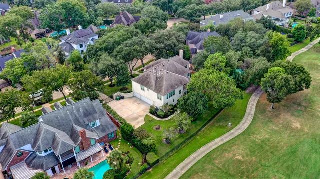 an aerial view of house with yard
