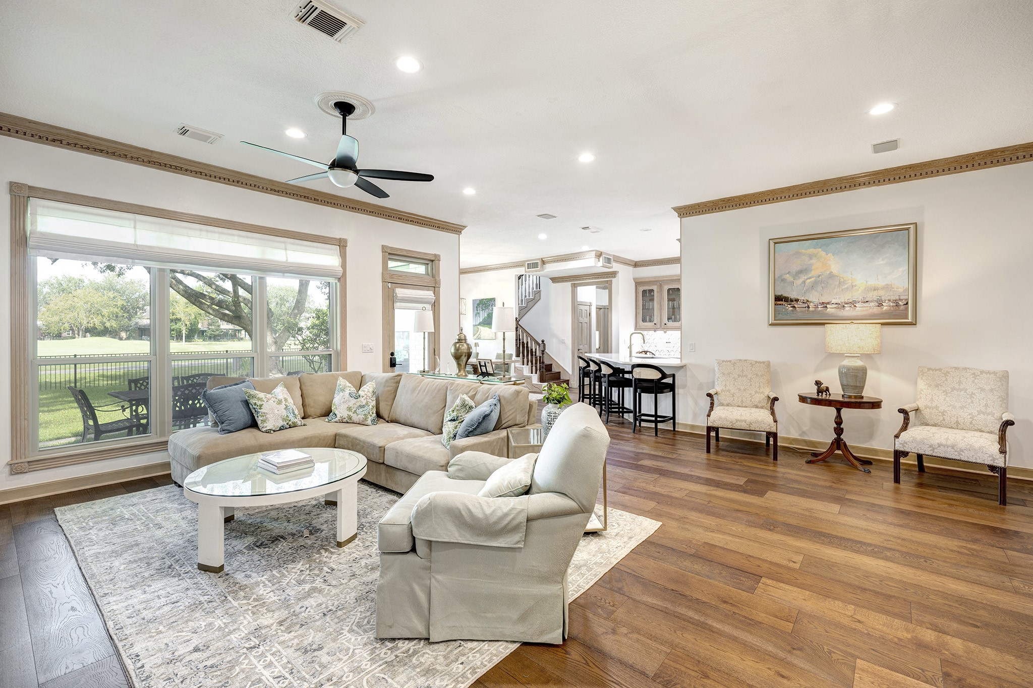 14310 Spring Maple Lane Houston, TX 77062 - Photo 8 of 40 a living room with furniture a large window and wooden floor