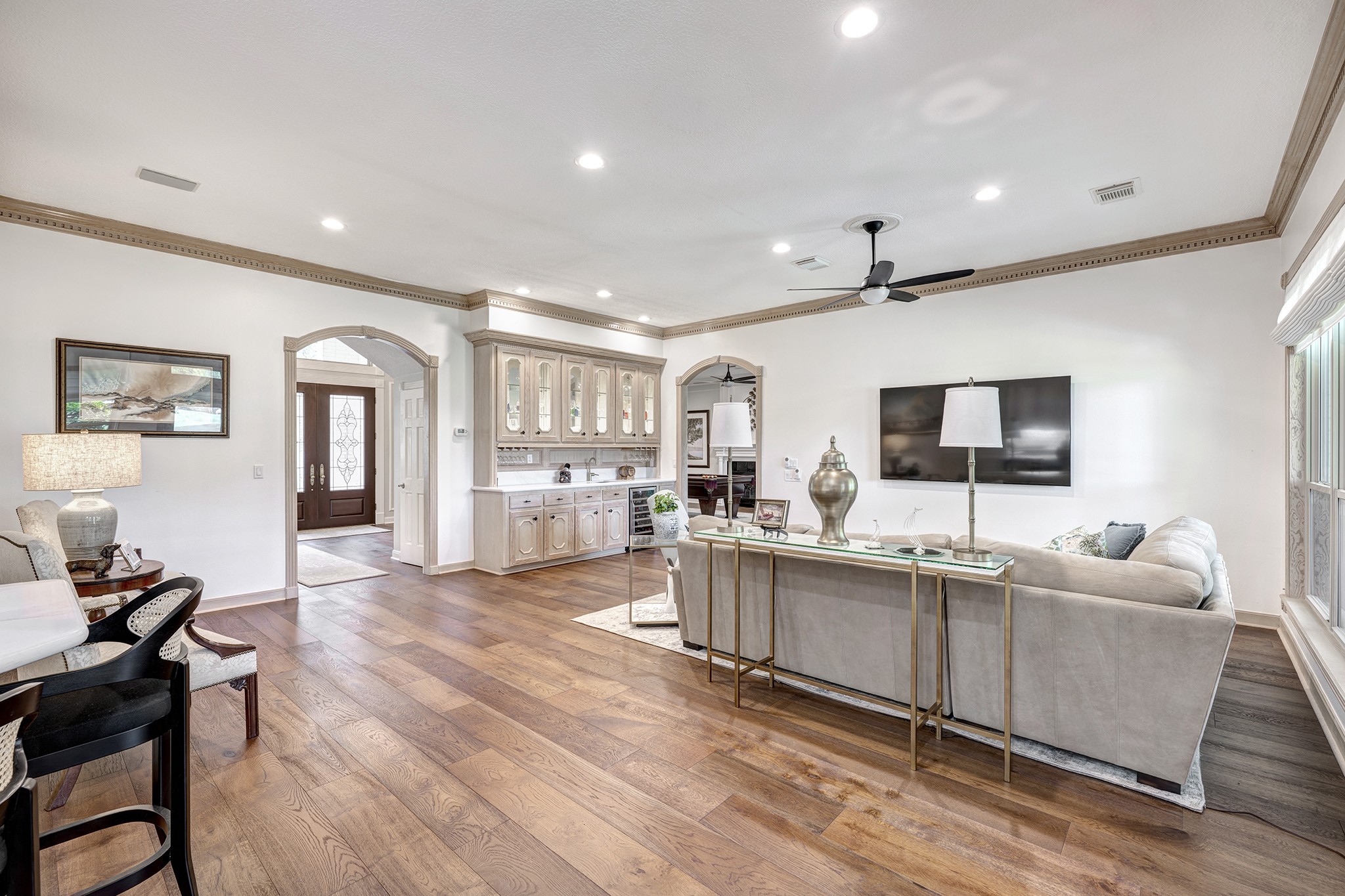 14310 Spring Maple Lane Houston, TX 77062 - Photo 9 of 40 a living room with furniture and a flat screen tv