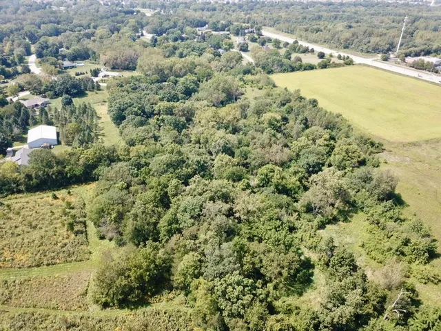 a view of a field with an ocean