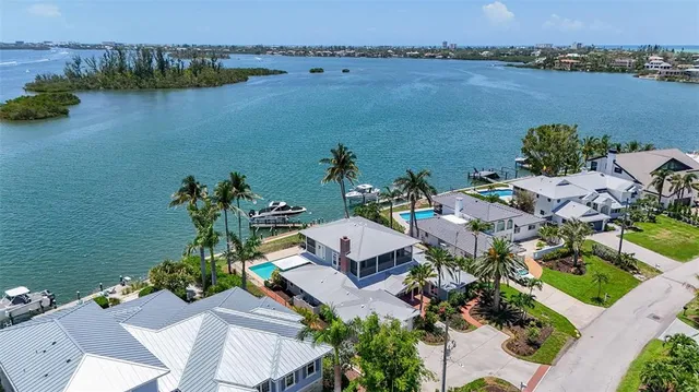a living room with furniture and large windows