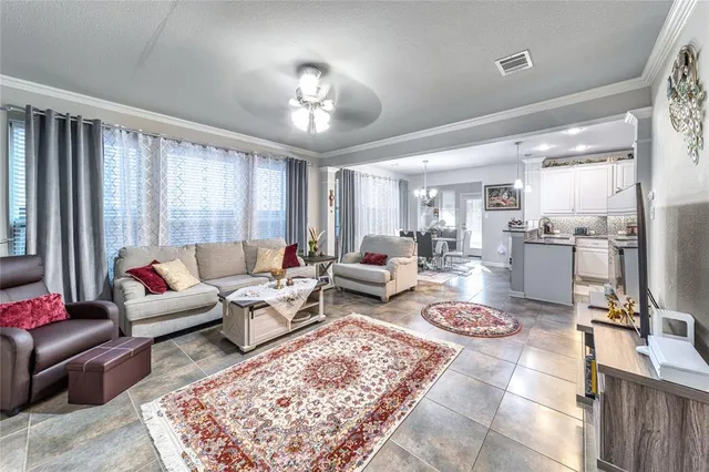 a living room with furniture and a table