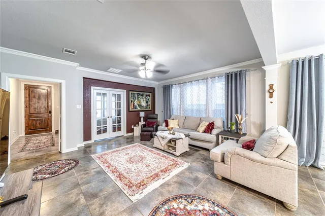 a living room with furniture and windows