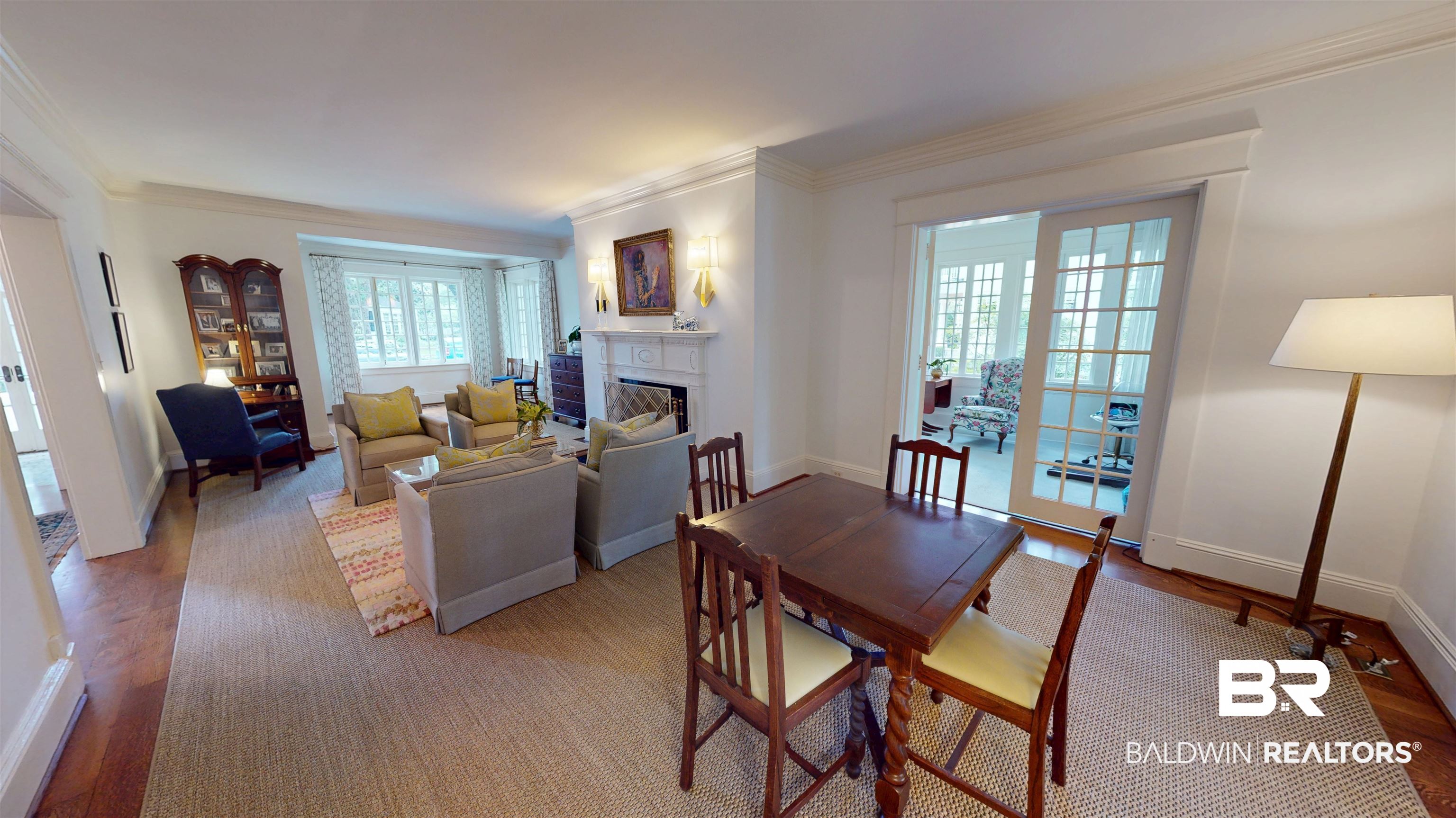 211 Lanier Avenue Mobile, AL 36607 - Photo 12 of 73 Dining area with ornamental molding, light wood-style flooring, and a fireplace